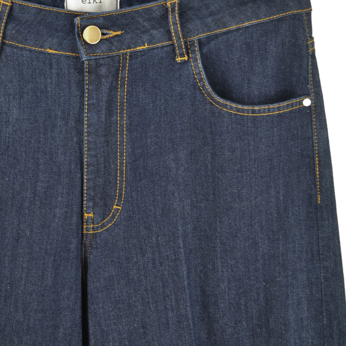 Jeans palazzo Peg Fashion Store in denim blu scuro con cuciture a contrasto color ocra e bottone dorato