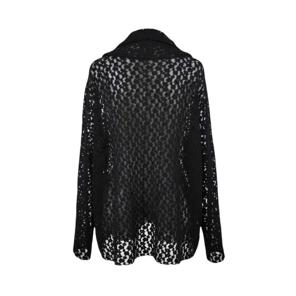 Blusa over con collo morbido